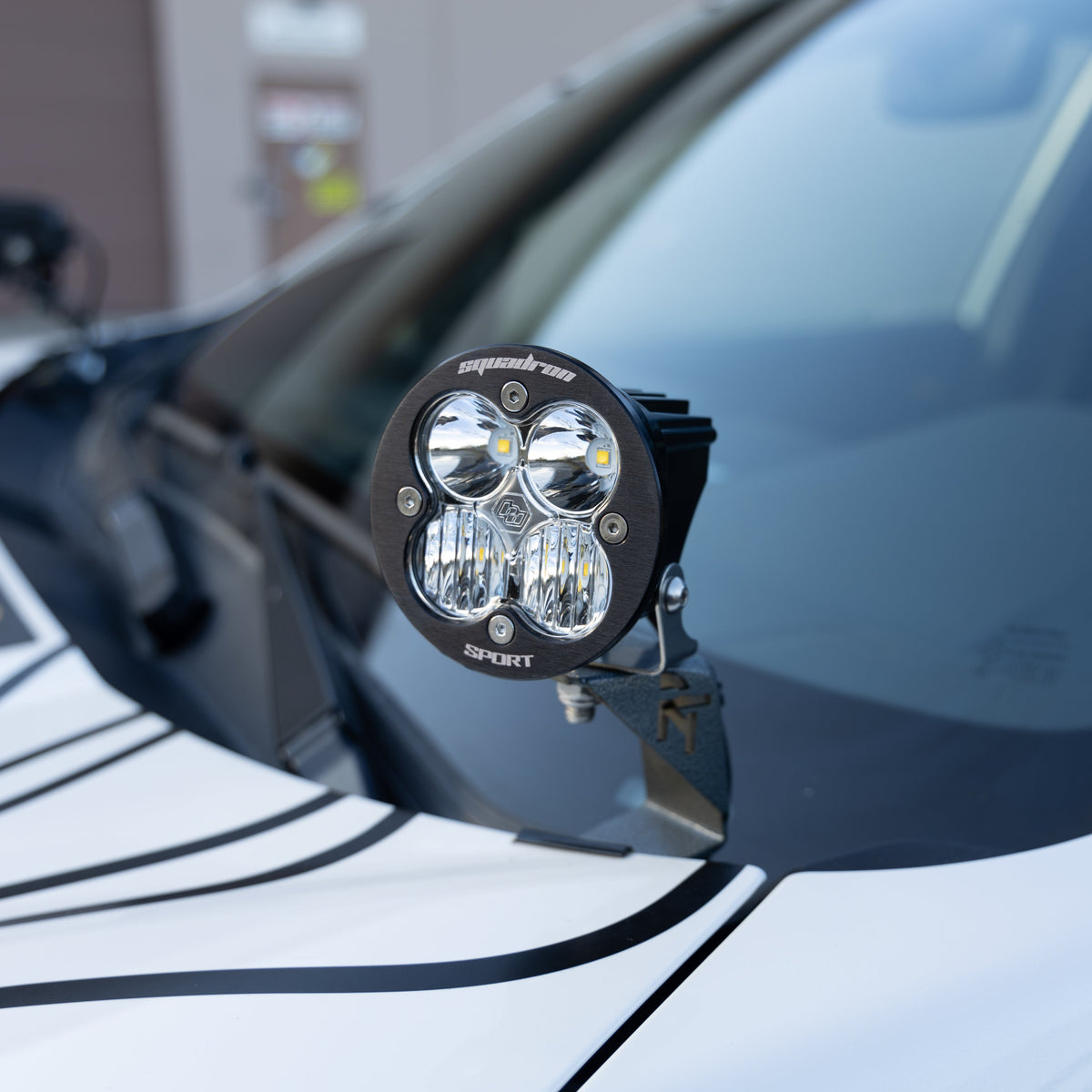 A pair of black steel ditch light mounts designed for the 2022-2024 Subaru Forester Wilderness.