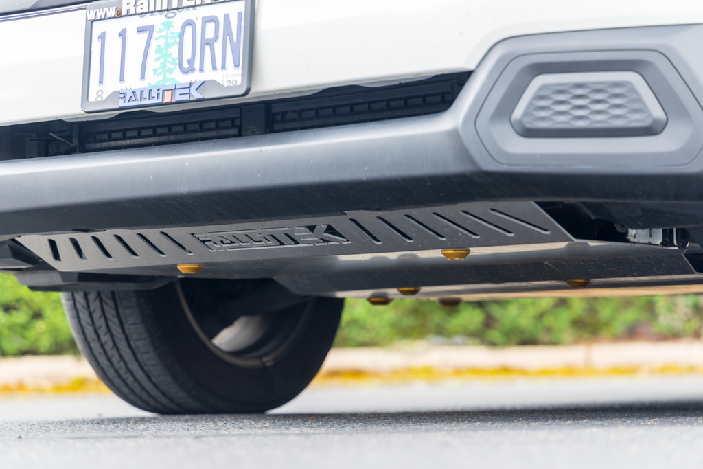2025 Forester Front Skid Plate Installed on vehicle with gold dome washers