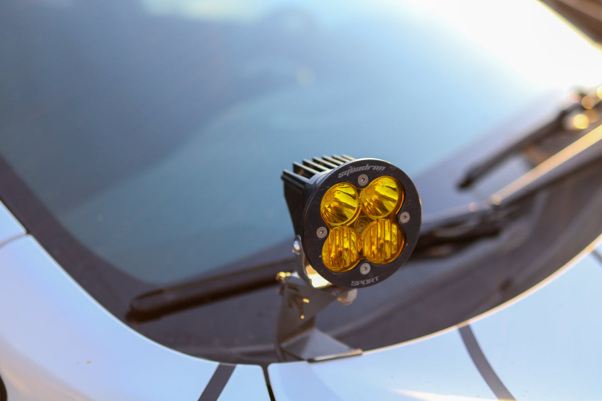 A pair of gray steel ditch light mounts designed for the 2022-2024 Subaru Forester Wilderness.